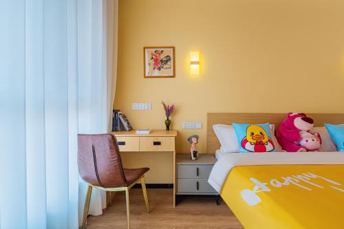 a bedroom with a bed with stuffed animals on it at JOYSEA HUT in Yantai