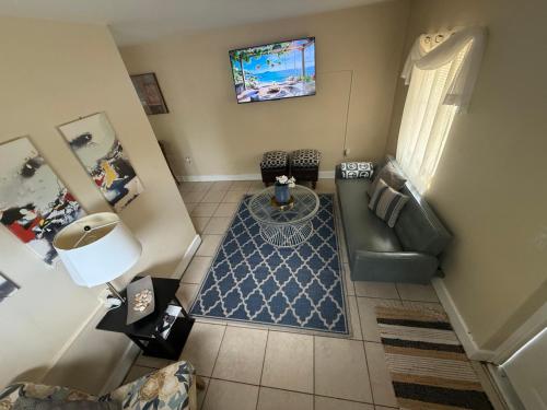 an overhead view of a living room with a couch and a table at SeaBreeze Retreat in Lantana