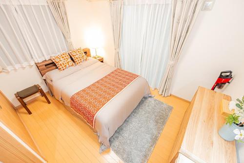 a bedroom with a large bed in a room at Anzu 4 Bed rooms Villa 5 minutes walk from Keise line Edogawa station in Tokyo