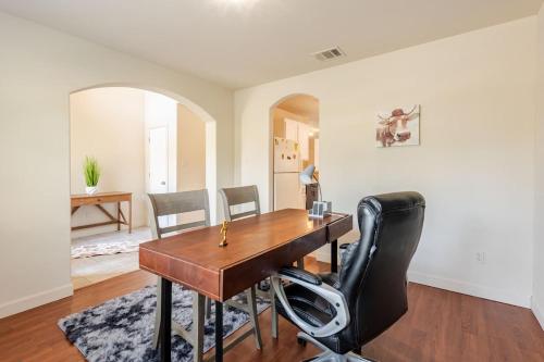 a dining room with a wooden table and chairs at Gorgeous 2story Home with 4 bedrooms in Buda