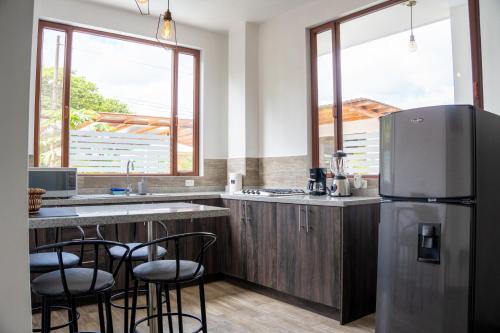 Kuchyň nebo kuchyňský kout v ubytování Toucan Platinum Suites Aparthotel