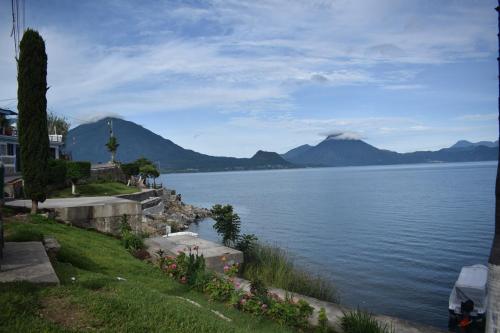 a view of a large body of water with mountains at Casa Gaspar on Lake Atitlán in San Antonio Palopó