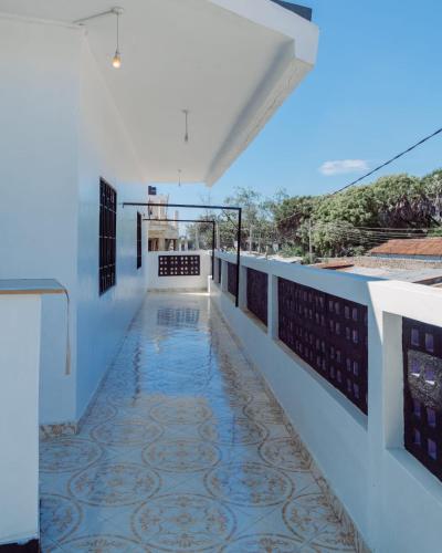 a view from the balcony of a house with a tile floor at jahazi homes -watamu in Watamu