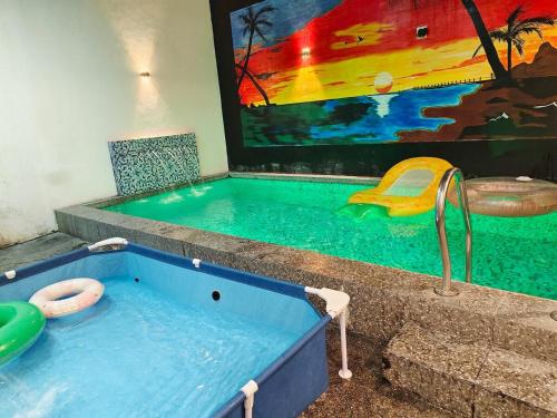 a large blue tub with a swimming pool at m4 Private Villa in Angeles