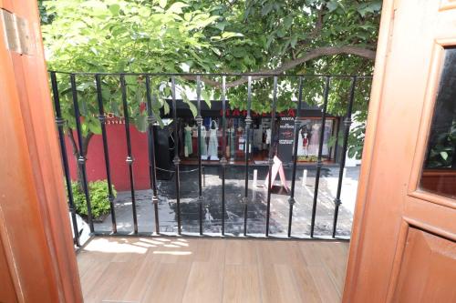 a gate with bottles of wine behind it at Hotel Casa Frida in Cuernavaca