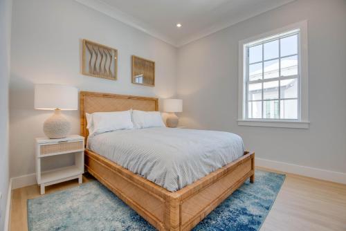 a bedroom with a large bed and a window at Sea Glass Cove by SoFLA Vacations in Marathon
