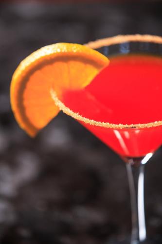 a red drink with an orange slice on top at Kansas City Marriott Downtown in Kansas City