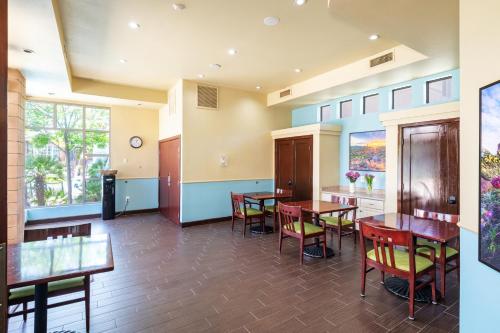 a dining room with tables and chairs in a building at The Cliffs at Peace Canyon in Las Vegas