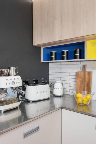 a kitchen with a counter top with appliances on it at 'Bulli Escape' Bright Beachfront Stay & Scenic Views in Bulli