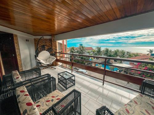 a balcony with a view of the ocean at Falésia Praia Hotel in Canoa Quebrada