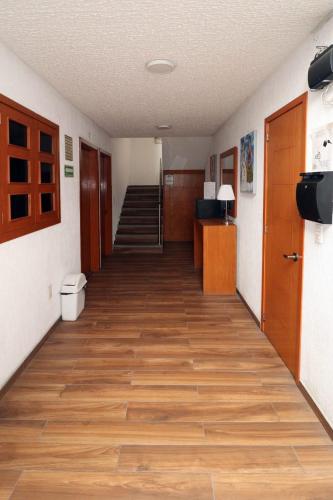 an empty hallway with a staircase in a room at Hotel Casa Frida in Cuernavaca