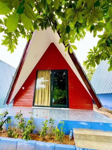 a small red house with a triangular window at SELA Bungalow and Italian Restaurant in Koh Rong