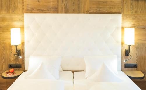 Alpbacherhof Mountain & Spa Resortにあるベッド