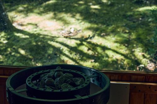 a basket full of broccoli in front of a window at Villa Noël Kitakaruizawa Seiryu Sauna & Open Air Bath in Tsumagoi