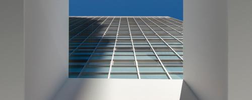 a tall skyscraper seen through a window at The Westin Houston Medical Center - Museum District in Houston