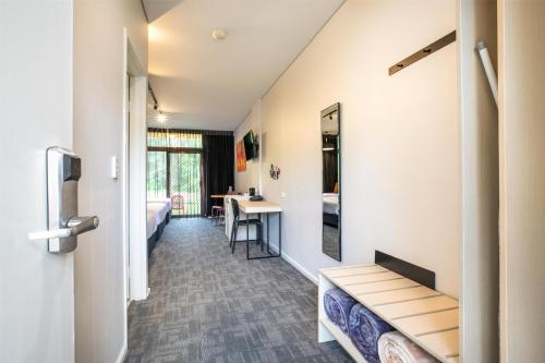 a room with a hallway with a desk and a table at Nightcap at York on Lilydale in Mount Evelyn