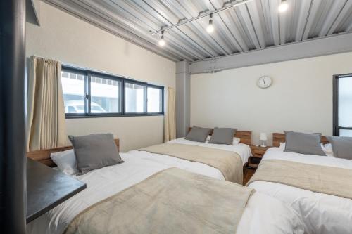Postel nebo postele na pokoji v ubytování Funabori