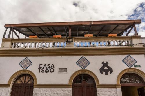 a balcony on the top of a building at Casa Tsao in Bogotá