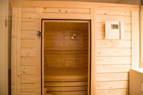 a wooden door in a room with a wall at Haus-Alster-2 in Westerland (Sylt)