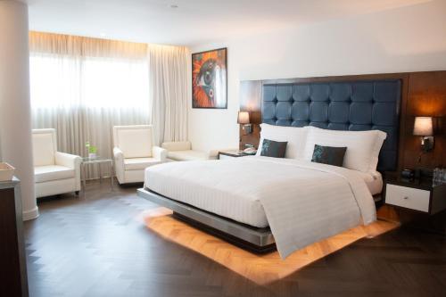 Letto o letti in una camera di Night Hotel Bangkok - Sukhumvit 15
