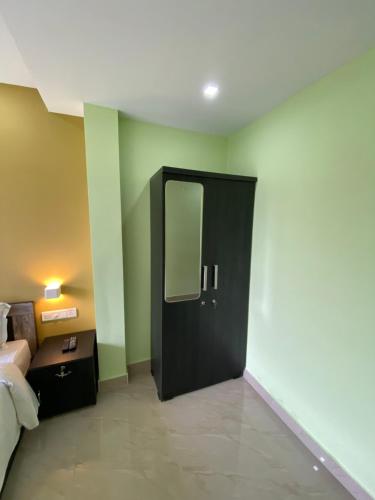 Ένα ή περισσότερα κρεβάτια σε δωμάτιο στο Munnar BnB
