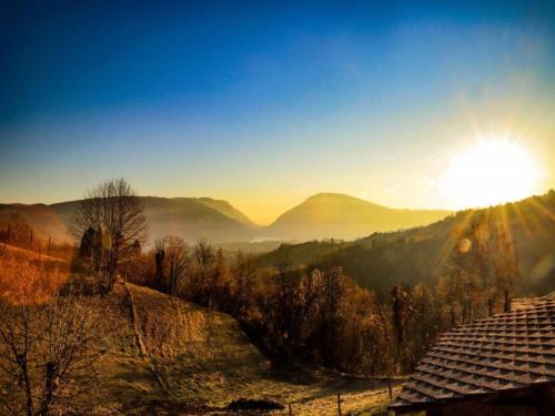 a view of the sun rising over the mountains at Retreat in the Dolomites in Chies dʼAlpago
