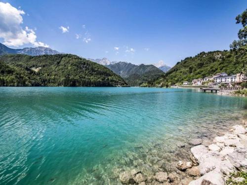 a view of a lake with mountains in the background at Retreat in the Dolomites in Chies dʼAlpago