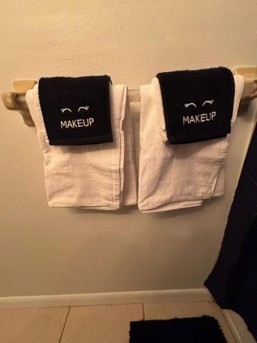 a group of towels are hanging on a wall at Apartment in Bonita in Bonita Springs