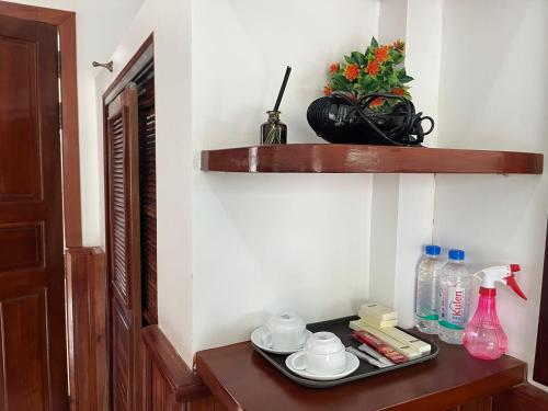a room with a table with a plate of food on it at NanaSky Kampot Residence 