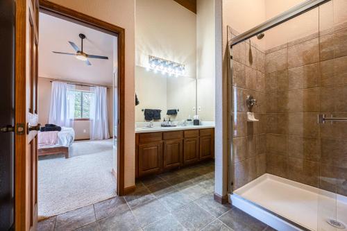 a bathroom with a shower and a sink at Whispering Pine Chalet - HotTub, Sauna, StargazingNet in Fairplay