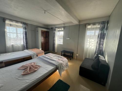 Ένα ή περισσότερα κρεβάτια σε δωμάτιο στο cliffside Homestay cherrapunji
