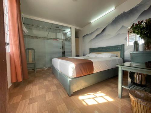 Cama o camas de una habitación en Cozi Hotel