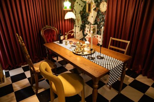 a dining room with a wooden table and chairs at Private house 100sqm with bicycles Disney 30min in Tokyo