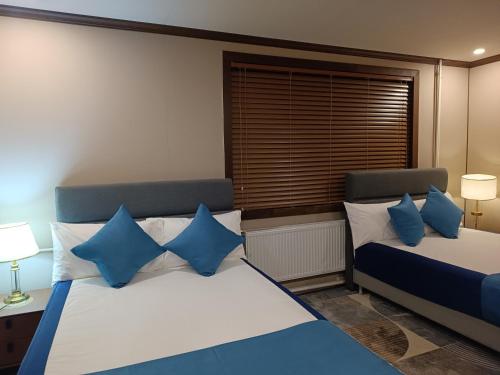 Кровать или кровати в номере Four Seasons Hotel Choibalsan Dornod