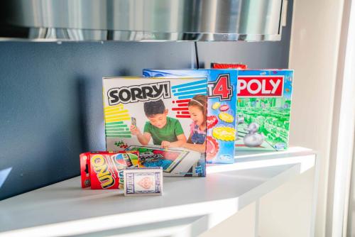 a shelf with some boxes of toys on it at Adorable 1BD - Central Downtown - Gym, Pool, Parking in Phoenix