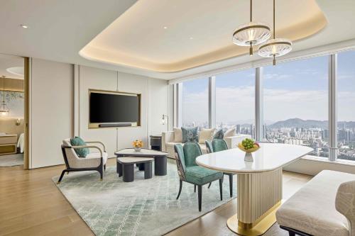 a living room with a view of a city at Shangri-La Nanshan, Shenzhen, Stay for 2 consecutive nights and enjoy breakfast in Shenzhen