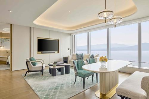 a living room with a couch and a table at Shangri-La Nanshan, Shenzhen, Stay for 2 consecutive nights and enjoy breakfast in Shenzhen