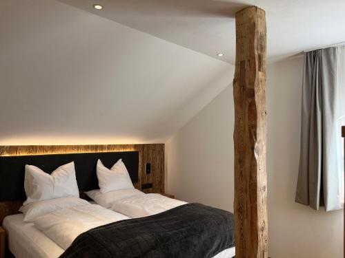 Ένα ή περισσότερα κρεβάτια σε δωμάτιο στο Maginta Appartements Lercher