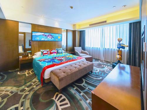 a hotel room with a bed and a desk at Wuhan Gleetour Hotel in Wuhan