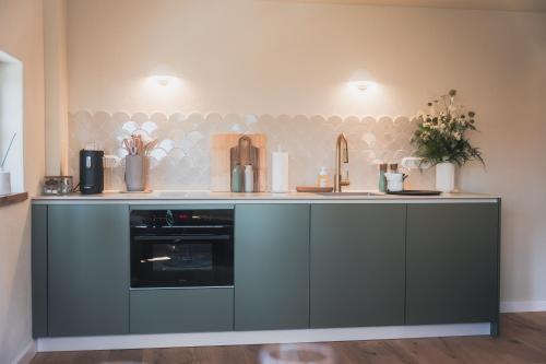 a kitchen with a counter and a sink at Übernachten im Wahrzeichen I Das Brückenhaus in Bad Kreuznach