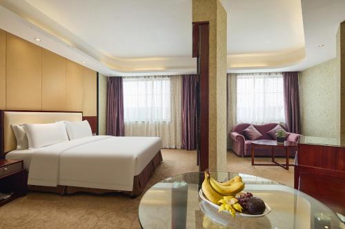 Katil atau katil-katil dalam bilik di Vyluk Hotel Xiangshan Wanda Plaza