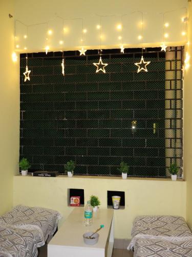 a room with two beds and stars on the wall at Nomad's Nest Backpackers Hostel in Guwahati