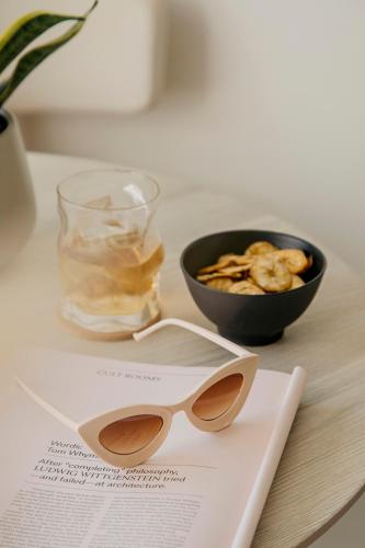 a pair of glasses and a bowl of chips on a table at Paradisus Salinas Lanzarote - All Inclusive - Adults Only in Costa Teguise