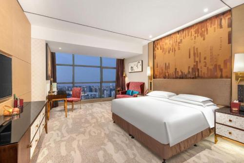 Postel nebo postele na pokoji v ubytování Shijiazhuang Ximeijin Continental Hotel