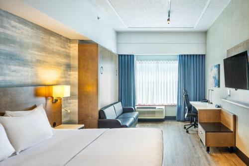 Ένα ή περισσότερα κρεβάτια σε δωμάτιο στο Quality Inn & Suites