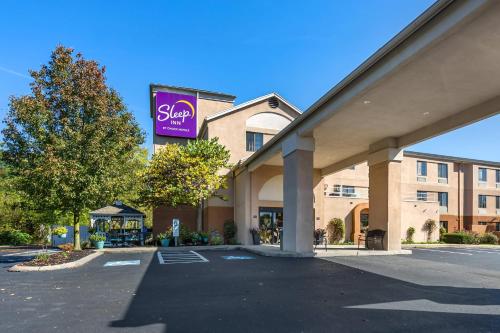 a building with a sign for a hotel at Sleep Inn near Penn State - State College, PA in State College