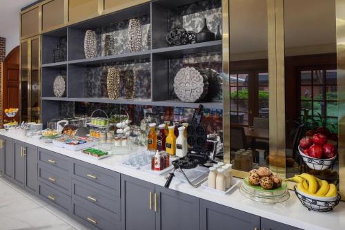 a buffet line with fruit and other foods on display at The Inn at Henderson's Wharf, an Ascend Collection Hotel in Baltimore