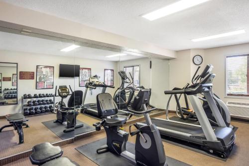 a gym with several treadmills and elliptical machines at Sleep Inn near Penn State - State College, PA in State College