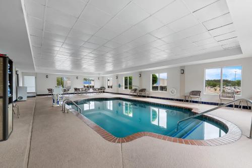 a large swimming pool in a large room with a large ceiling at Comfort Suites Columbia at Harbison in Columbia