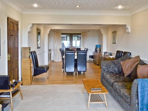 a living room with a couch and a table at Woodend Bungalow in Hucknall under Huthwaite